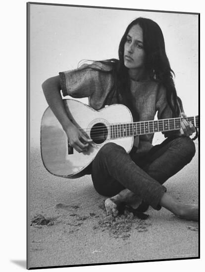 Folk Singer Joan Baez Strumming Her Guitar on the Beach Near Her Home-Ralph Crane-Mounted Premium Photographic Print