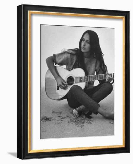 Folk Singer Joan Baez Strumming Her Guitar on the Beach Near Her Home-Ralph Crane-Framed Premium Photographic Print