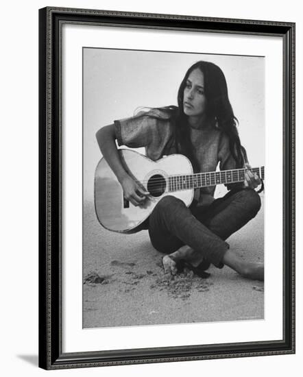 Folk Singer Joan Baez Strumming Her Guitar on the Beach Near Her Home-Ralph Crane-Framed Premium Photographic Print