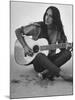 Folk Singer Joan Baez Strumming Her Guitar on the Beach Near Her Home-Ralph Crane-Mounted Premium Photographic Print