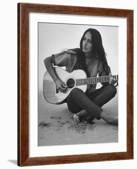 Folk Singer Joan Baez Strumming Her Guitar on the Beach Near Her Home-Ralph Crane-Framed Premium Photographic Print