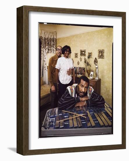 Folk Singer Richie Havens Leaning on Xylophone with Parents: Richard and Mildred in Background-John Olson-Framed Photographic Print