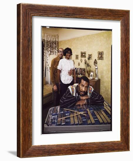 Folk Singer Richie Havens Leaning on Xylophone with Parents: Richard and Mildred in Background-John Olson-Framed Photographic Print