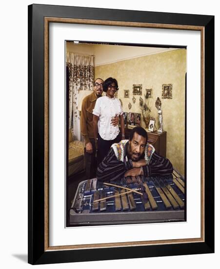 Folk Singer Richie Havens Leaning on Xylophone with Parents: Richard and Mildred in Background-John Olson-Framed Photographic Print