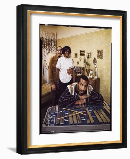 Folk Singer Richie Havens Leaning on Xylophone with Parents: Richard and Mildred in Background-John Olson-Framed Photographic Print