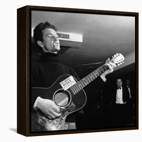 Folk Singer Woody Guthie Performing with Guitar Emblazoned with "This Machine Kills Fascists"-Eric Schaal-Framed Premier Image Canvas