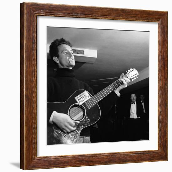 Folk Singer Woody Guthie Performing with Guitar Emblazoned with "This Machine Kills Fascists"-Eric Schaal-Framed Premium Photographic Print