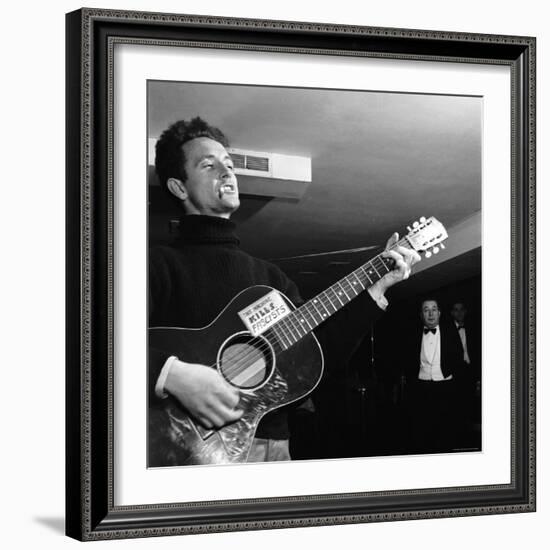 Folk Singer Woody Guthie Performing with Guitar Emblazoned with "This Machine Kills Fascists"-Eric Schaal-Framed Premium Photographic Print