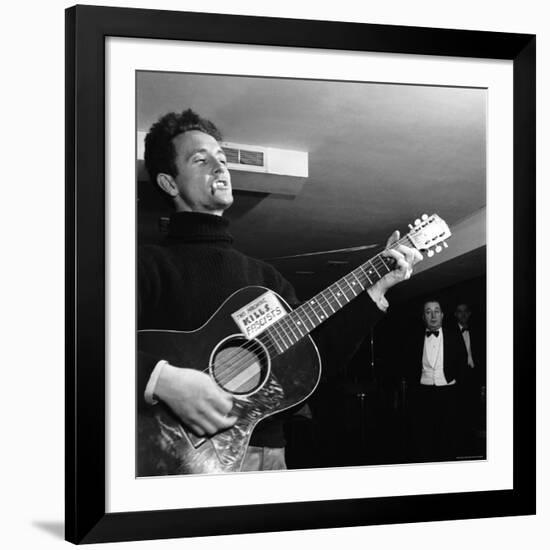 Folk Singer Woody Guthie Performing with Guitar Emblazoned with "This Machine Kills Fascists"-Eric Schaal-Framed Premium Photographic Print