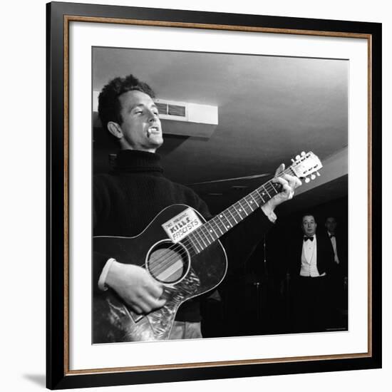 Folk Singer Woody Guthie Performing with Guitar Emblazoned with "This Machine Kills Fascists"-Eric Schaal-Framed Premium Photographic Print