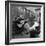 Folk Singer Woody Guthrie Palying His Guitar While Getting a Shoeshine-null-Framed Premium Photographic Print