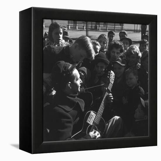 Folk Singer Woody Guthrie Playing Guitar for Group of Children-Eric Schaal-Framed Premier Image Canvas