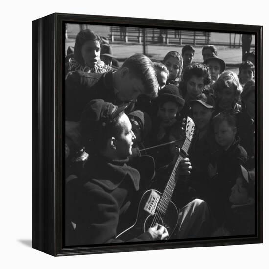 Folk Singer Woody Guthrie Playing Guitar for Group of Children-Eric Schaal-Framed Premier Image Canvas