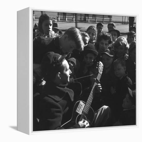 Folk Singer Woody Guthrie Playing Guitar for Group of Children-Eric Schaal-Framed Premier Image Canvas