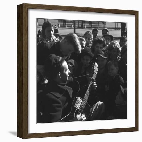 Folk Singer Woody Guthrie Playing Guitar for Group of Children-Eric Schaal-Framed Premium Photographic Print
