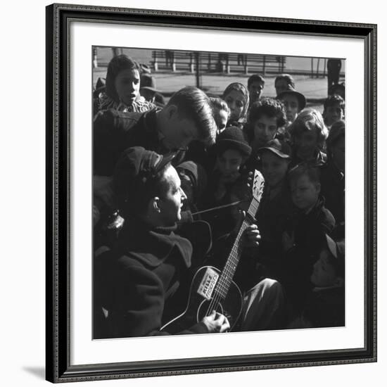 Folk Singer Woody Guthrie Playing Guitar for Group of Children-Eric Schaal-Framed Premium Photographic Print