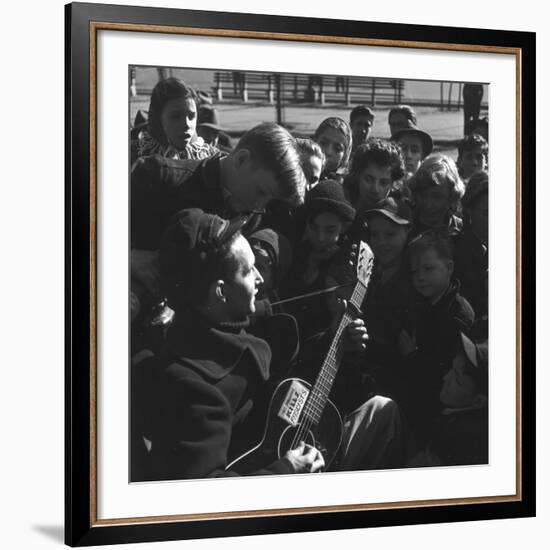 Folk Singer Woody Guthrie Playing Guitar for Group of Children-Eric Schaal-Framed Premium Photographic Print