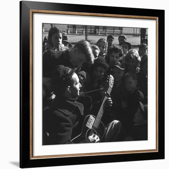 Folk Singer Woody Guthrie Playing Guitar for Group of Children-Eric Schaal-Framed Premium Photographic Print