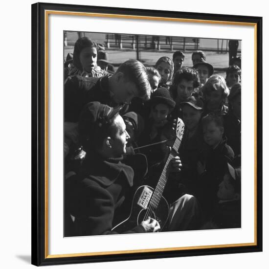 Folk Singer Woody Guthrie Playing Guitar for Group of Children-Eric Schaal-Framed Premium Photographic Print