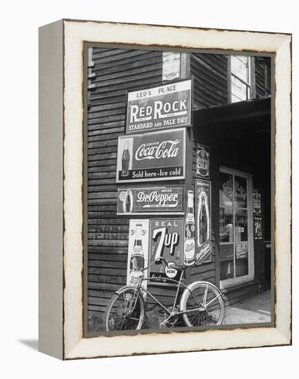 Food Store Called Leo's Place Covered with Beverage Ads Incl. Coca Cola, 7 Up, Dr. Pepper and Pepsi-Alfred Eisenstaedt-Framed Premier Image Canvas