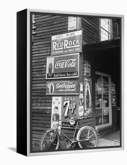 Food Store Called Leo's Place Covered with Beverage Ads Incl. Coca Cola, 7 Up, Dr. Pepper and Pepsi-Alfred Eisenstaedt-Framed Premier Image Canvas