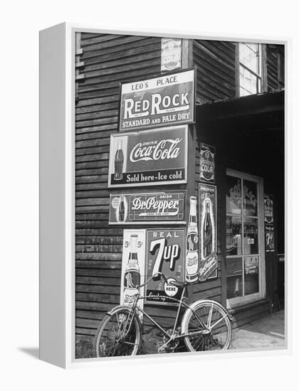 Food Store Called Leo's Place Covered with Beverage Ads Incl. Coca Cola, 7 Up, Dr. Pepper and Pepsi-Alfred Eisenstaedt-Framed Premier Image Canvas