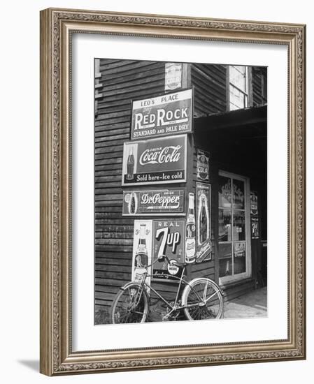 Food Store Called Leo's Place Covered with Beverage Ads Incl. Coca Cola, 7 Up, Dr. Pepper and Pepsi-Alfred Eisenstaedt-Framed Photographic Print