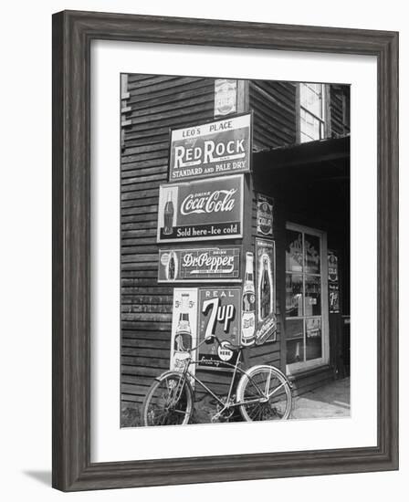 Food Store Called Leo's Place Covered with Beverage Ads Incl. Coca Cola, 7 Up, Dr. Pepper and Pepsi-Alfred Eisenstaedt-Framed Photographic Print