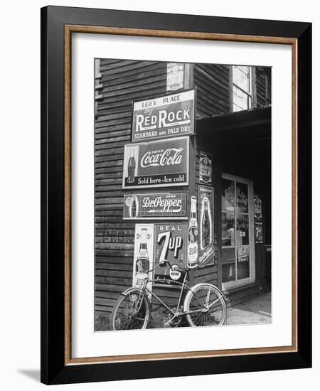 Food Store Called Leo's Place Covered with Beverage Ads Incl. Coca Cola, 7 Up, Dr. Pepper and Pepsi-Alfred Eisenstaedt-Framed Photographic Print