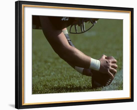 Football Center About to Snap the Ball-Paul Sutton-Framed Photographic Print