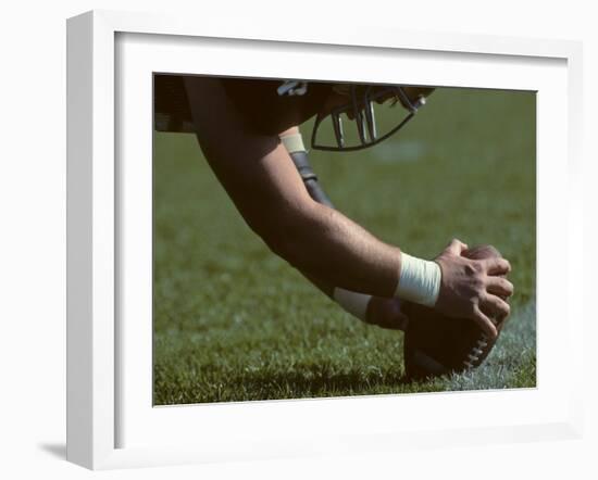 Football Center About to Snap the Ball-Paul Sutton-Framed Photographic Print