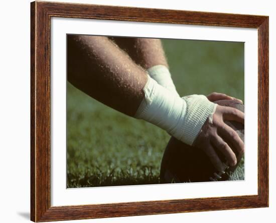 Football Center About to Snap the Ball-Paul Sutton-Framed Photographic Print