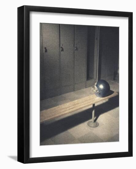 Football Helmet on Bench in Locker Room-null-Framed Photographic Print