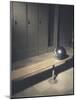 Football Helmet on Bench in Locker Room-null-Mounted Photographic Print