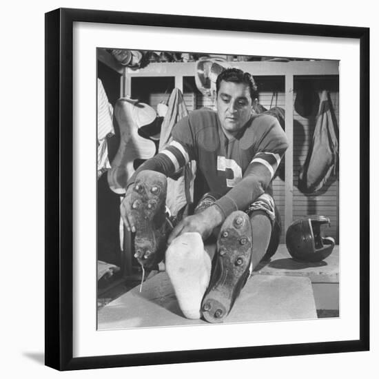 Football Player Ben Agajanian Putting on Football Cleats-Allan Grant-Framed Premium Photographic Print