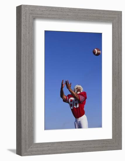 Football Player Catching a Football-DLILLC-Framed Photographic Print