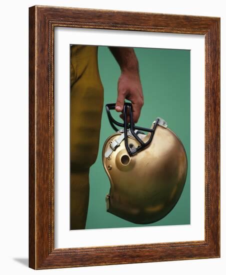 Football Player Holding His Helmet-Chris Trotman-Framed Photographic Print