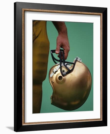 Football Player Holding His Helmet-Chris Trotman-Framed Photographic Print