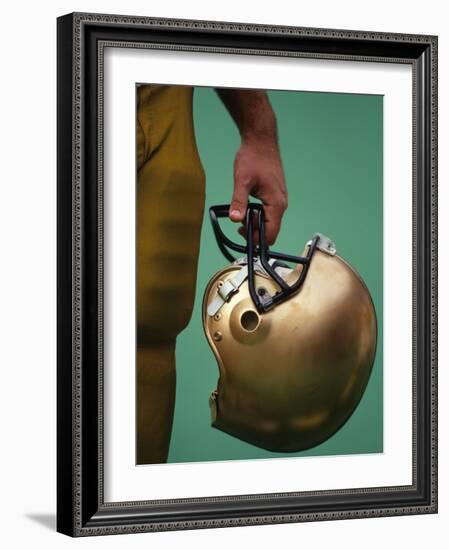 Football Player Holding His Helmet-Chris Trotman-Framed Photographic Print