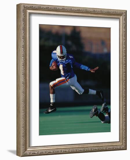 Football Player in Action-null-Framed Photographic Print