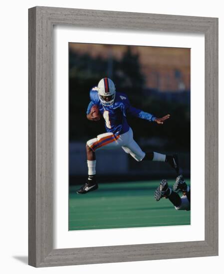 Football Player in Action-null-Framed Photographic Print