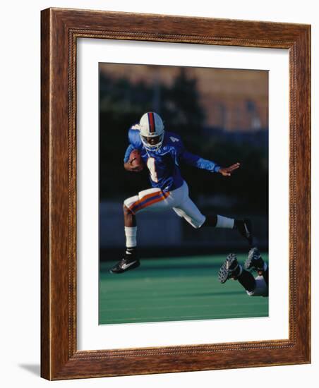 Football Player in Action-null-Framed Photographic Print