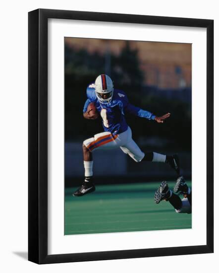 Football Player in Action-null-Framed Photographic Print