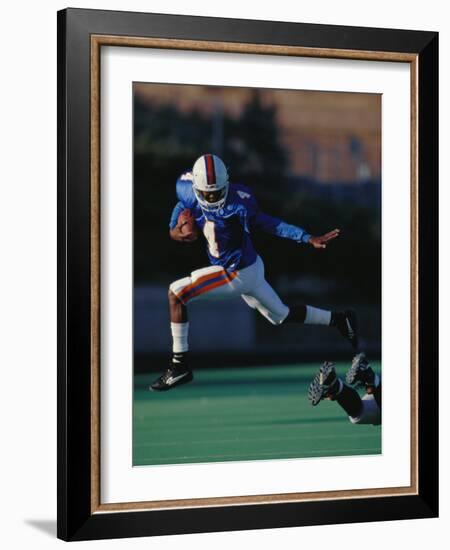 Football Player in Action-null-Framed Photographic Print