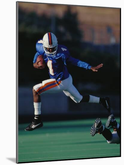 Football Player in Action-null-Mounted Photographic Print