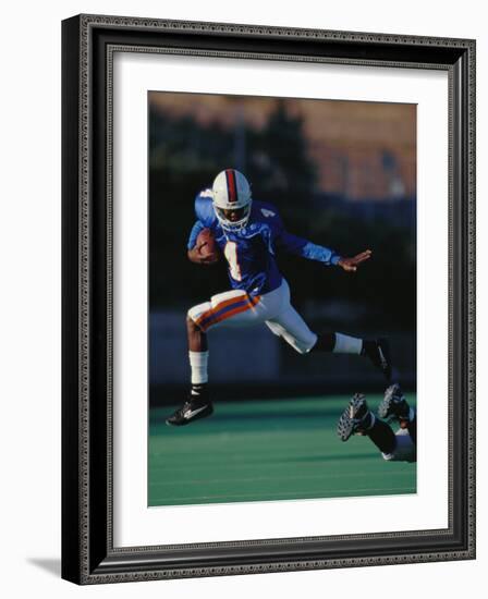 Football Player in Action-null-Framed Photographic Print