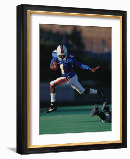 Football Player in Action-null-Framed Photographic Print