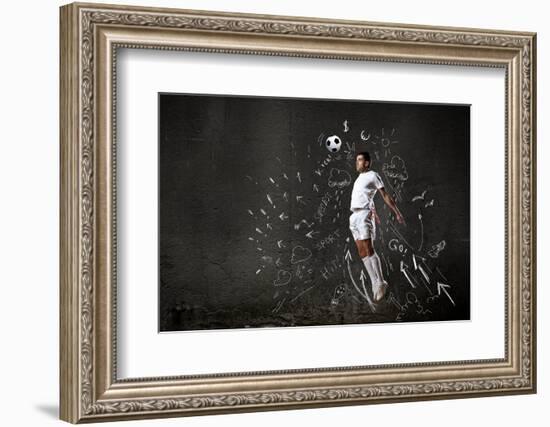 Football Player in Jump Striking Ball with Sketches at Backdrop-Sergey Nivens-Framed Photographic Print