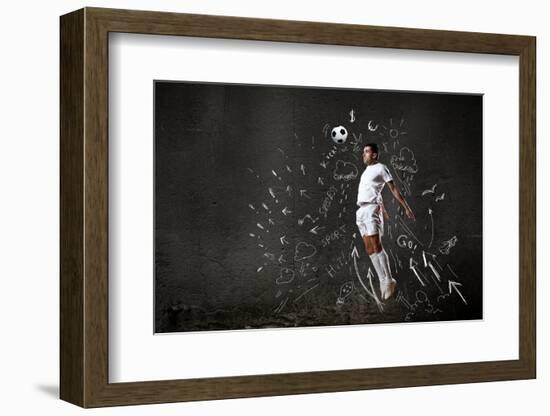 Football Player in Jump Striking Ball with Sketches at Backdrop-Sergey Nivens-Framed Photographic Print