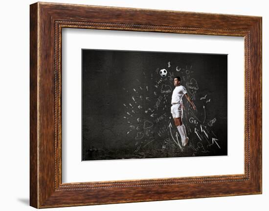 Football Player in Jump Striking Ball with Sketches at Backdrop-Sergey Nivens-Framed Photographic Print